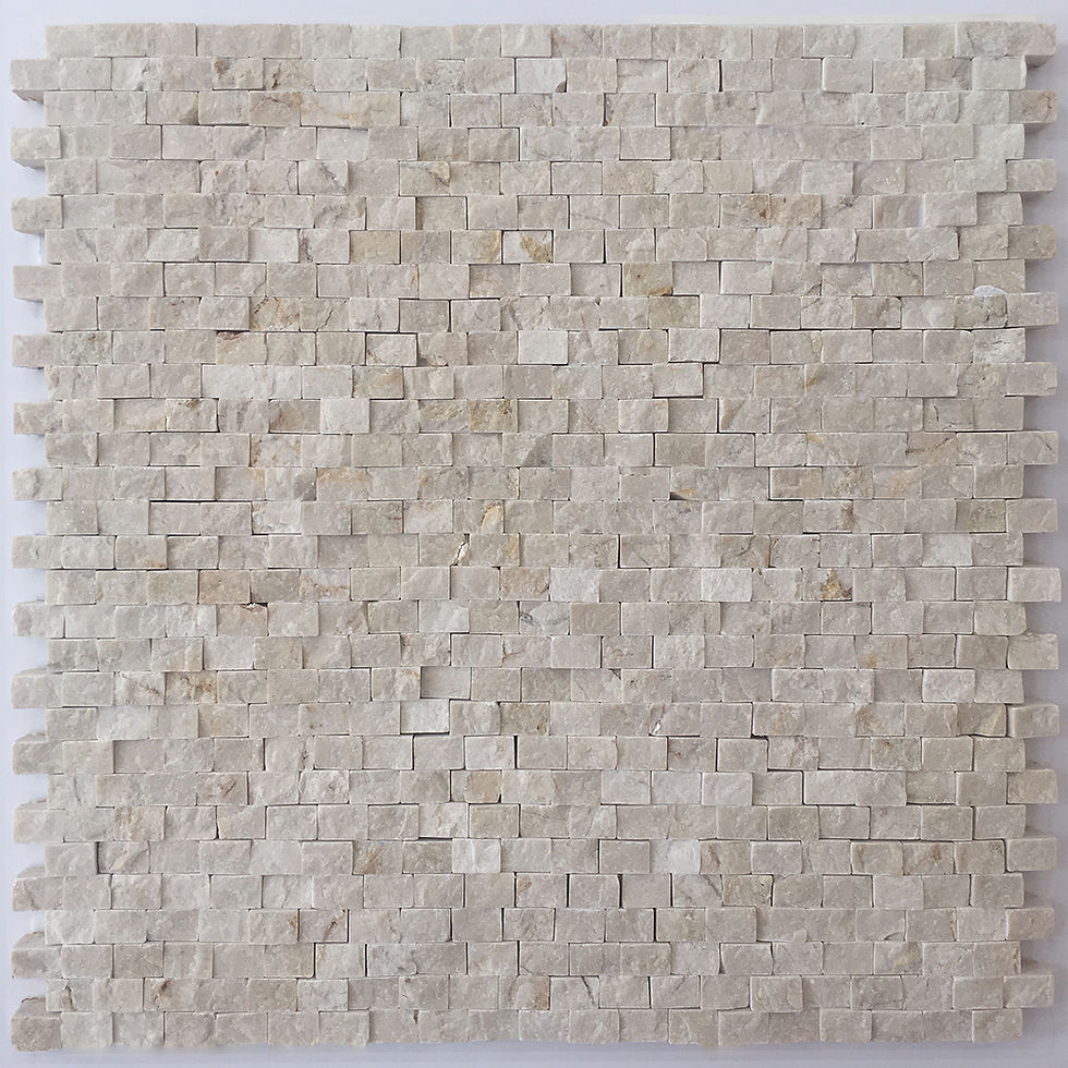 Crema Marfil splitface marble mosaic in a brick joint pattern