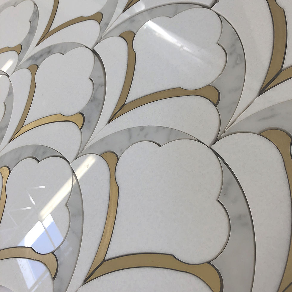 Palmette Thassos & Brass: a pattern reminiscent of art deco, with gold brass accents and waterjet finesse