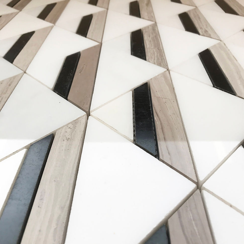 Thumbnail: A contrasting, contemporary geometric triangle pattern created by using different marbles in white, black & taupe