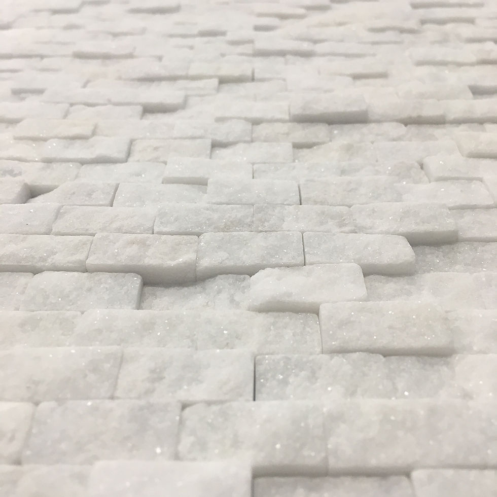 Thumbnail: Bianco HIzhou splitface tumbled mosaic stone tile will add interest and texture to your walls
