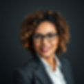 mixed race woman middle aged with curly hair in suit head shot.jpg
