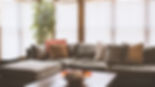 couch with blinds behind