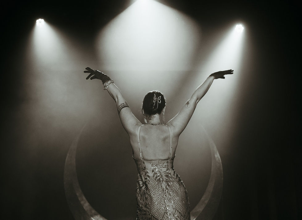 a woman in a dress with the number 98 on her back