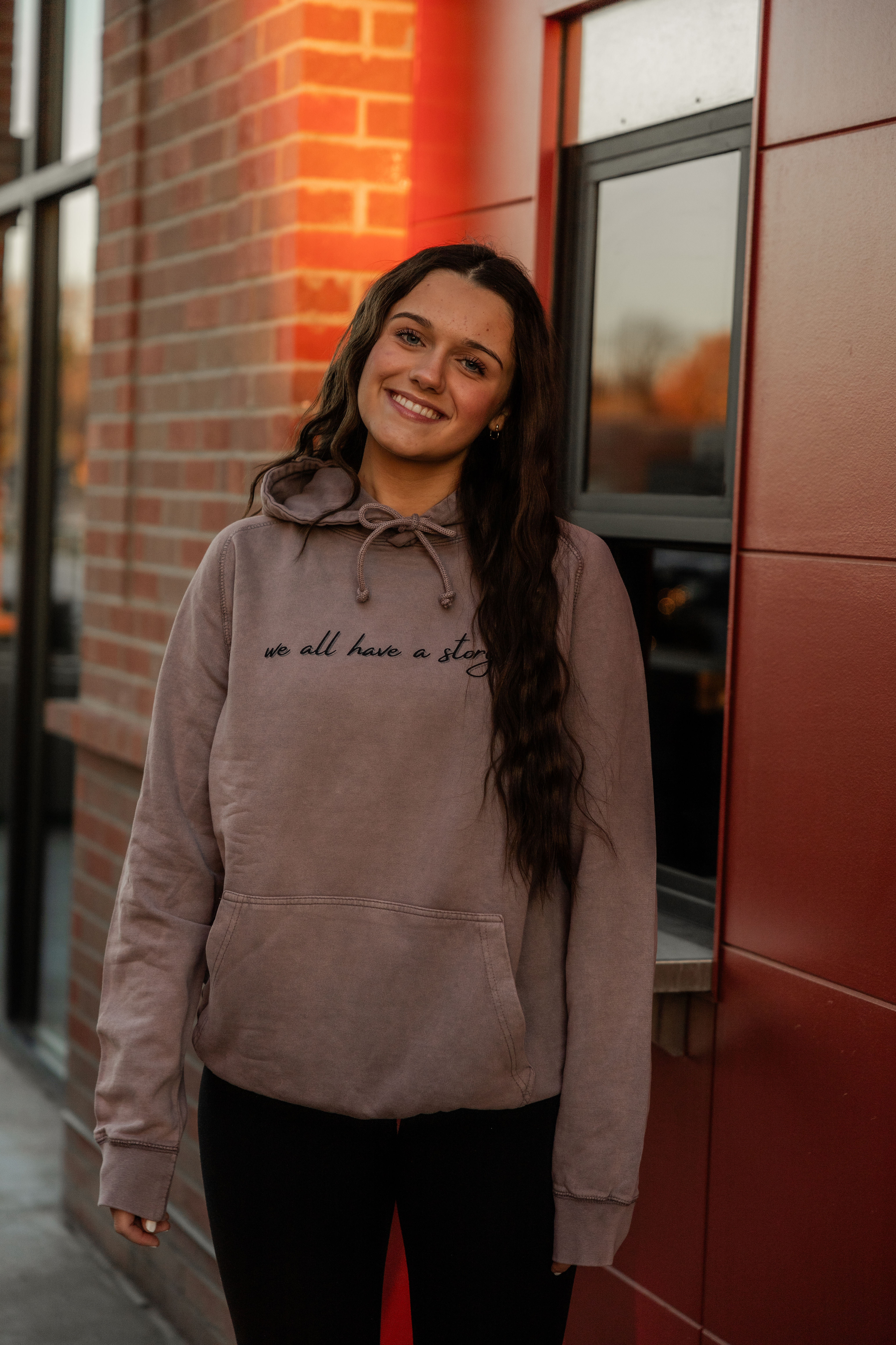 WE ALL HAVE A STORY UNISEX HOODIE