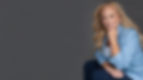Blonde woman in blue blazer smiling