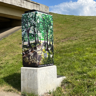 Utility box wrapped with art; Painting; Moss-Wright Park Trail by J. Murphy