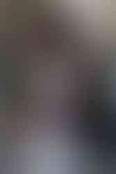 Black man in ankara bomer jacket