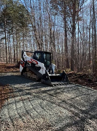 Skidsteer installing a residential driveway