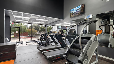 Cardio workout room with treadmills, bikes and stair climbers.