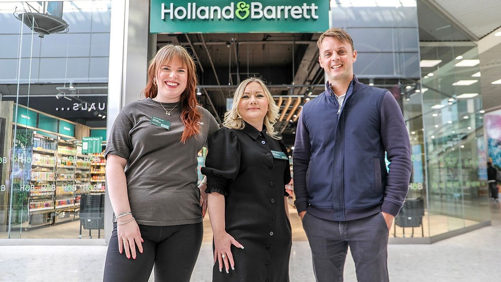 Holland & Barrett staff outside their Swansea store