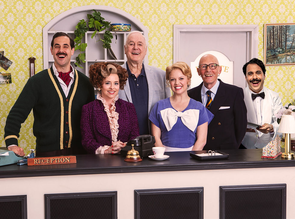 John Cleese with the cast of his stage adaptation of Fawlty Towers