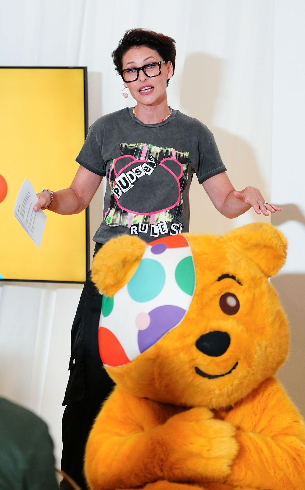 Emma Willis unveils her new Children in Need T-Shirt with.children and young people who have been supported by BBC Children in Need funded projects during a fashion show at Sanderson Hotel London. Picture date: Wednesday September 17, 2025. PA Photo. Photo credit should read: Ian West/PA Wire
