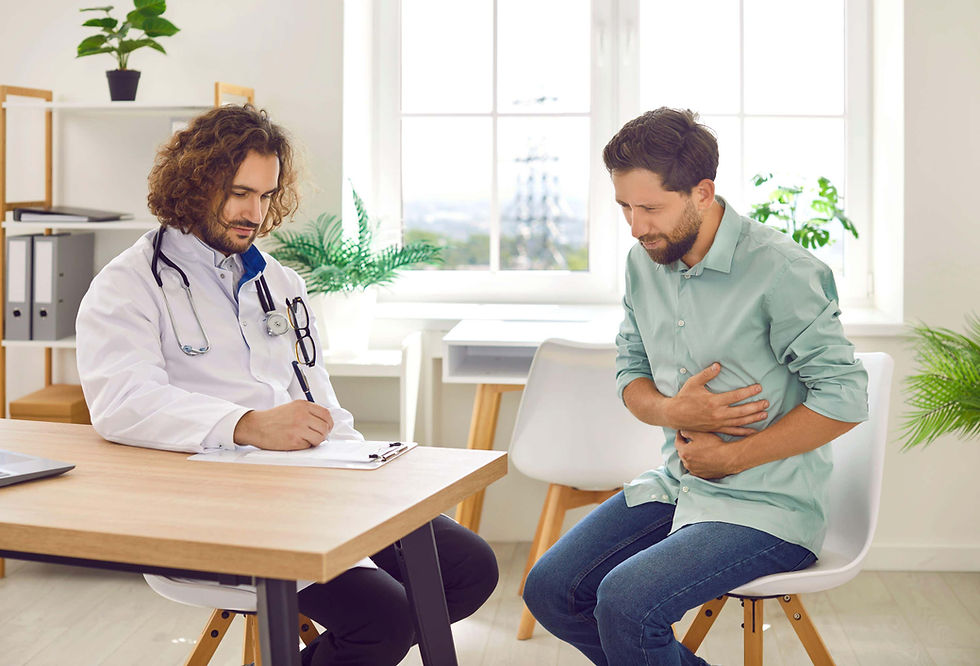 Male patient talking to male doctor about stomach problems