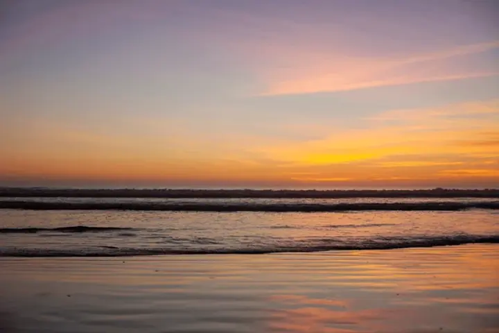 colorful-sunset-over-ocean-pismo-600nw-2314265507.webp