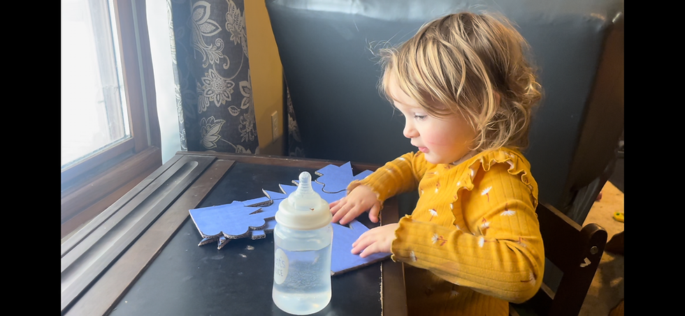 Our 3-year old enjoying a homemade puzzle