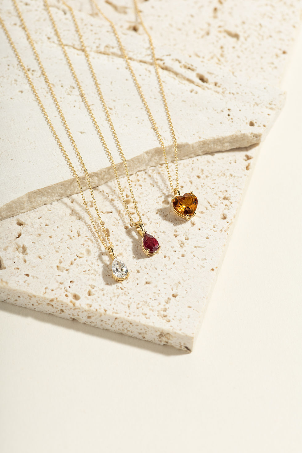 Thumbnail: Delicate necklaces on display, NOVEMBER pendant - Madeira Citrine - LUMIÈRE, white background.