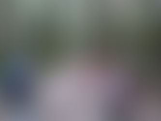 three people starting a hike through a forest