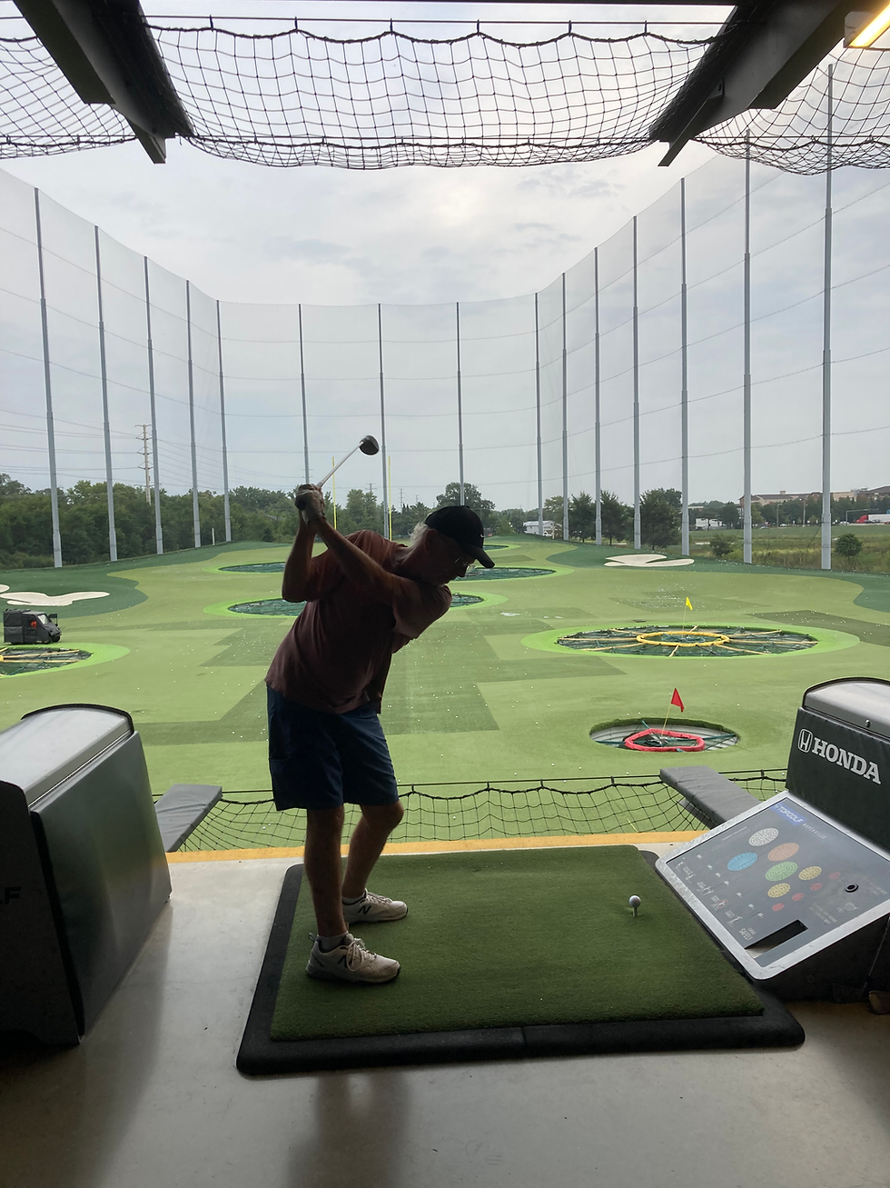 man swinging golf club