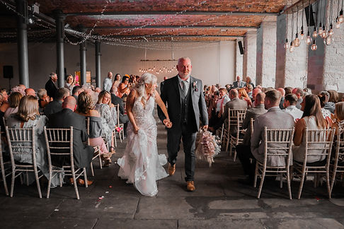 Couple walking down isle