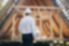Man builder. Rear view of foreman with laptop. Contractor for construction company. Archit