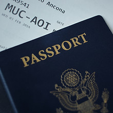 Passport close up with ticket Photo by Nicole Geri on Unsplash representing citizenship by investment