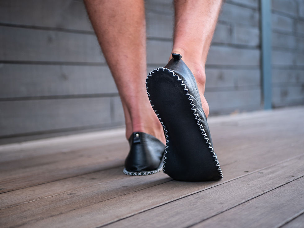 Thumbnail: Black men's barefoot shoes handcrafted for comfort, featuring soft leather soles that support grounding and natural movement
