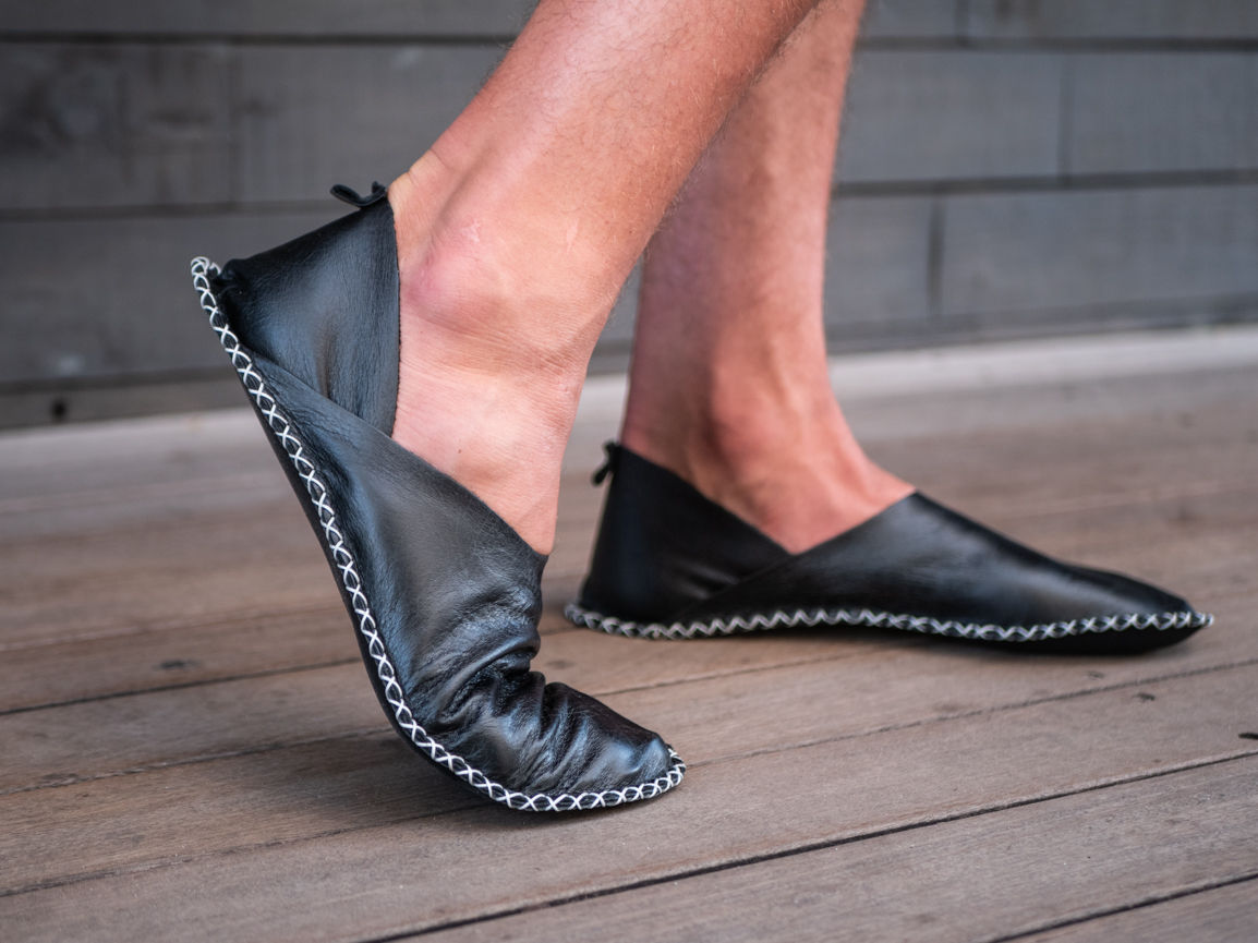 Minimalist mens black recycled leather barefoot shoe designed for comfort, breathability, and a connected walking experience