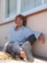Thumbnail: Joyful man wearing black barefoot shoes made from sustainable leather, designed for ease, style, and grounded living.