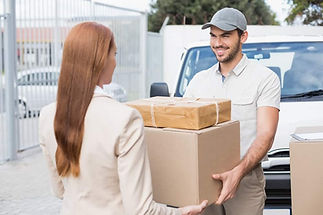 Delivery-driver-passing-parcels-to-customer.jpeg