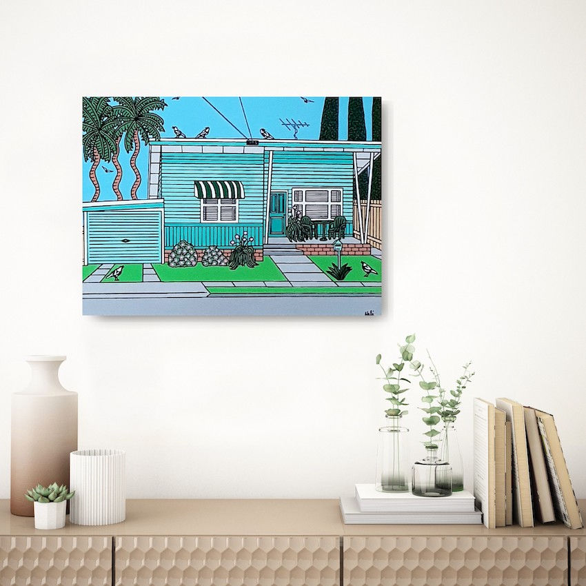 Thumbnail: A cute minty green beach shack shown hanging in a room.