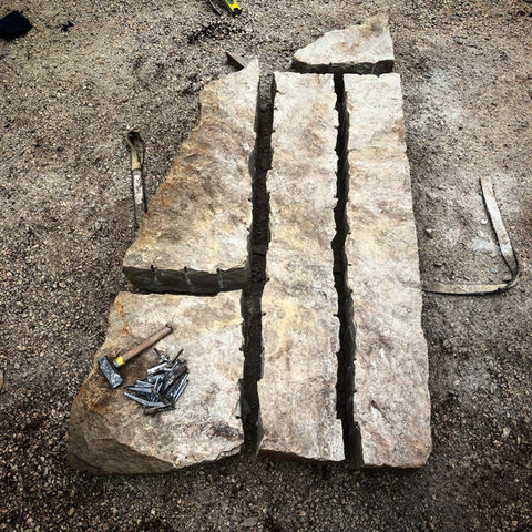Dry stone splitting process  by ADL stonework dry stone waller in Ontario Andre Lemieux
