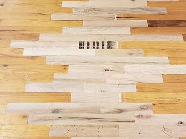 Replacing old hardwood flooring weaving in new