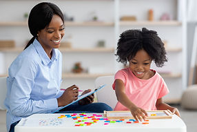 smiling-child-development-specialist-testing-cute-2022-02-15-18-49-40-utc-min.jpg