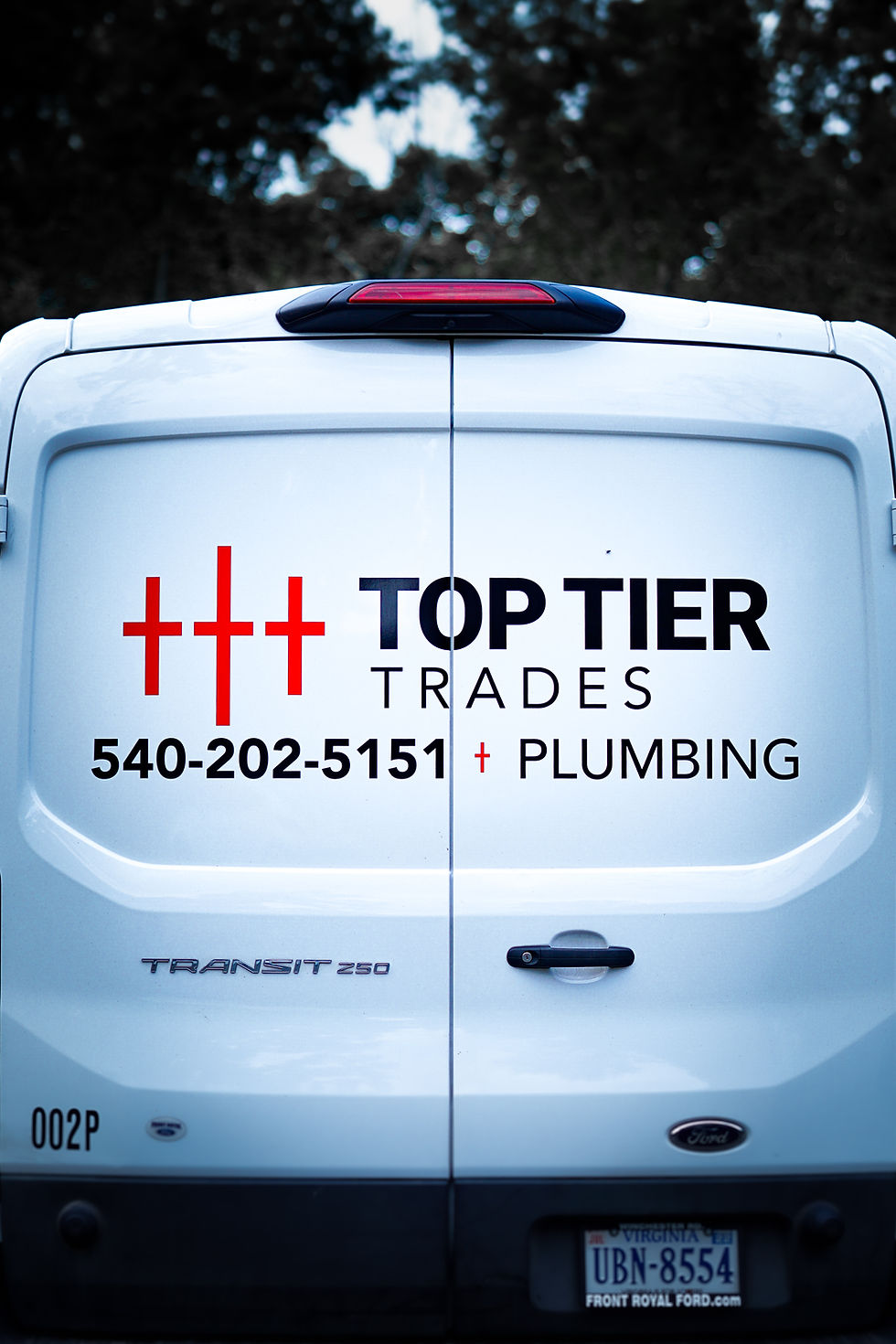 Top Tier Trades plumber providing 24/7 plumbing service for emergency repair in a residential home.