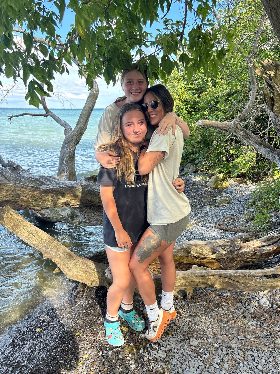 Andrea from Fit & Fuel 365 hiking outdoors with family while promoting a healthy and active lifestyle in Belleville.