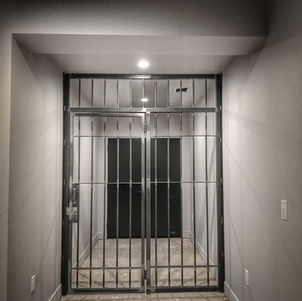Custom designed steel door for client's wine cellar. Rectangular locking doors.