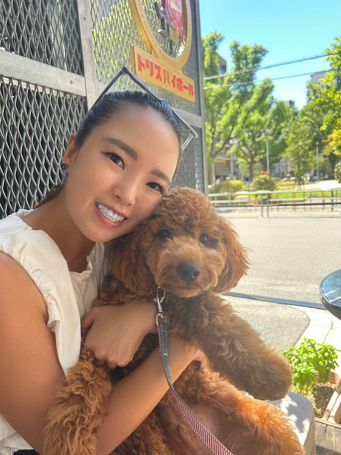 A happy owner and puppy