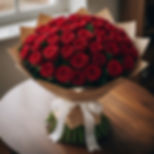 A vibrant red rose bouquet with a white ribbon from Floral Haven YYC. Calgary Flowers