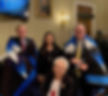 From left, standing, U.S. Representatives Paul Cook (R-Calif.), Deb Haaland (D-N.M.), and Denny Heck (D-Wash.) with, seated, WWII Army veteran Marcella LeBeau, of the Cheyenne River Sioux Reservation. They are in the Longworth Capital Building, in Washington, D.C., to speak about the Remove the Stain Act, a bill to rescind Congressional Medals of Honor awarded for the Wounded Knee massacre. (Photo by OJ Semans.)
