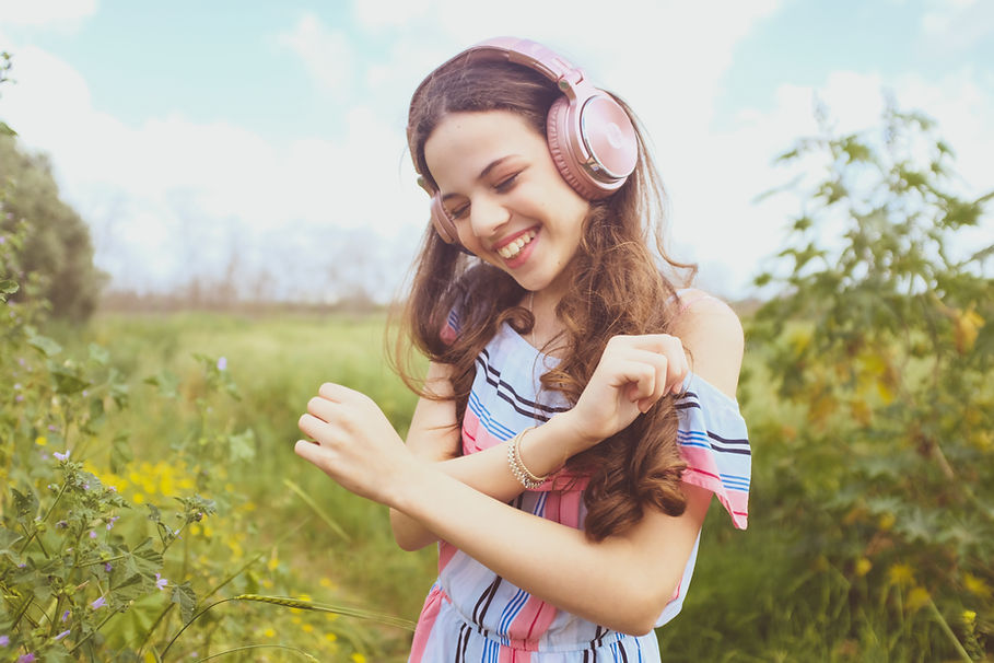 a girl with a smile in the fields