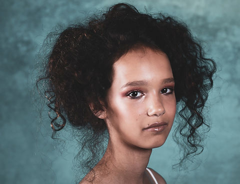 a girl with make up and hair style