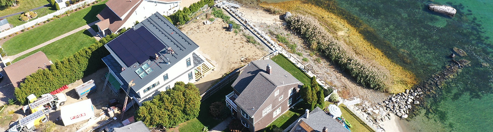 Coastal home with solar panels installed on the roof