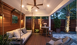 Modern covered patio with swinging sofa and dining area