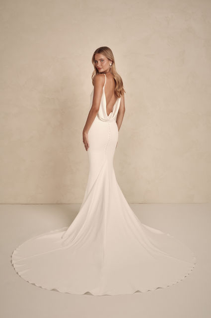 If elevated tradition is the wedding aesthetic you've been searching for, then look no further than our stunning Alfie.

MWL is known for our iconic cowls and Alfie's perfected pattern does not disappoint. Putting a new intricate twist on one of our favourite design elements, Alfie's double, crossed-cowl back is sure to draw the eye. Her flattering boat neck and delicate bodice draping contrasts perfectly with her renowned MWL fitted French crepe skirt, with a godet to hug your curves in all the right places.