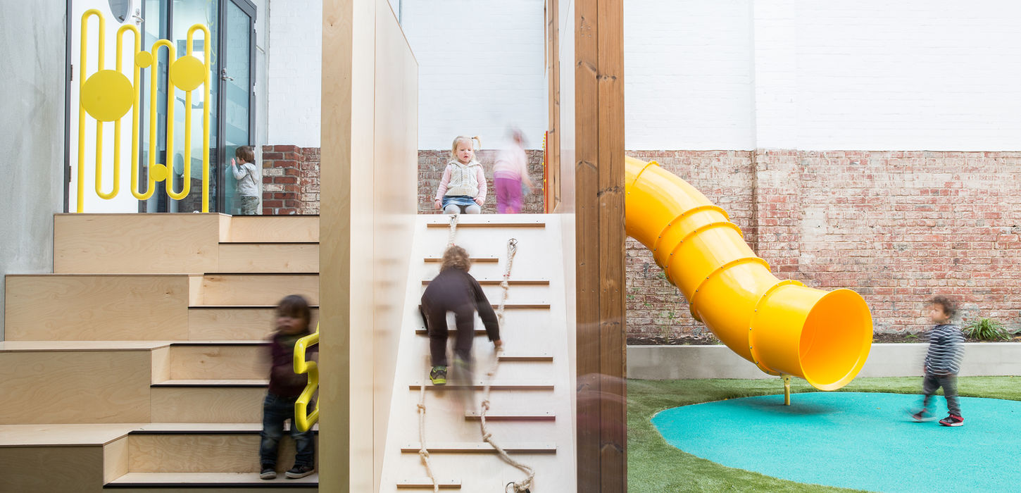 Interior play space at Lady Gowrie South Hobart, designed by Cumulus Studio, incorporating climbing walls and interactive joinery to foster informal learning