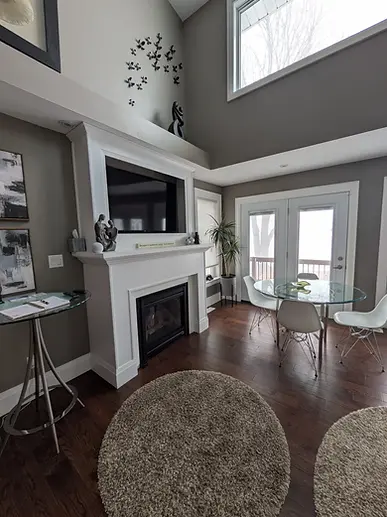 Comfortable seating and fireplace at a quiet Lake Erie cottage for Sprucewood wedding guests