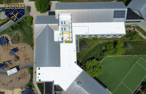 Wide view of a commercial roof with standing seam metal panels