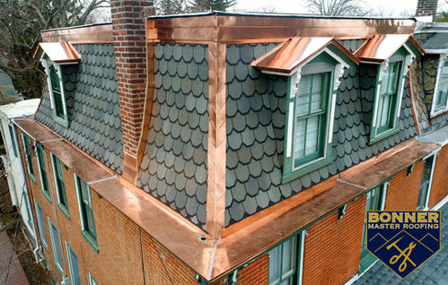 Decorative copper roof features adding charm to a traditional home