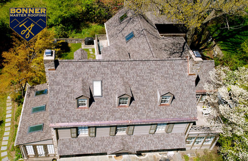 Bold copper roof trim and gutters creating striking curb appeal