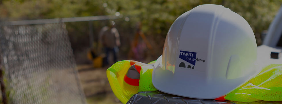 Construction hard hat and vest; MWM DesignGroup logo.
